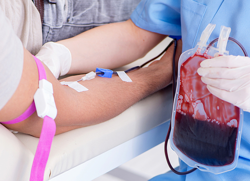 The patient getting blood transfusion in hospital clinic