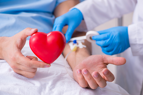 The male patient getting blood transfusion in hospital clinic