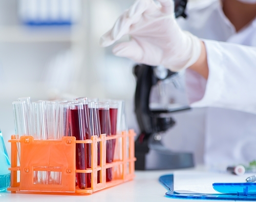 Female scientist researcher conducting an experiment in a laboratory