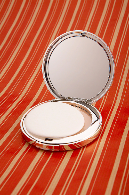 Collapsible mirror on a bright background