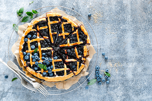 Traditional homemade american blueberry pie with lattice pastry, top view