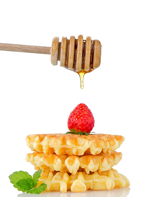 Belgian waffles and strawberries, stick for honey and honey isolated on white