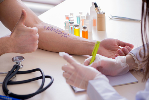 Doctor testing allergy reaction of patient in hospital