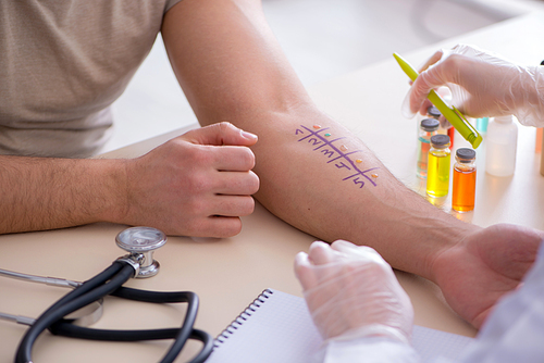 Doctor testing allergy reaction of patient in hospital