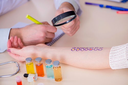 Doctor testing allergy reaction of patient in hospital