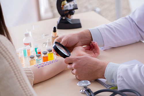 Doctor testing allergy reaction of patient in hospital