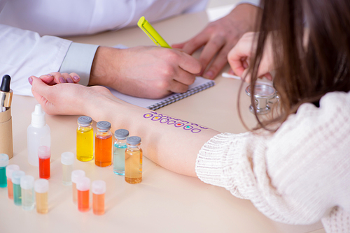 Doctor testing allergy reaction of patient in hospital