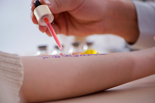 Doctor testing allergy reaction of patient in hospital