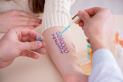 Doctor testing allergy reaction of patient in hospital