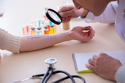 Doctor testing allergy reaction of patient in hospital