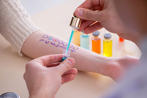 Doctor testing allergy reaction of patient in hospital