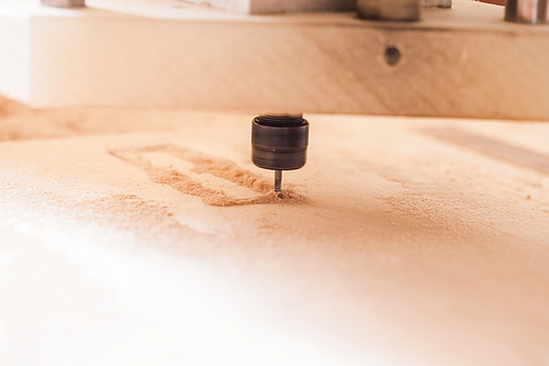 Machine working, close up view of  milling cutter wood