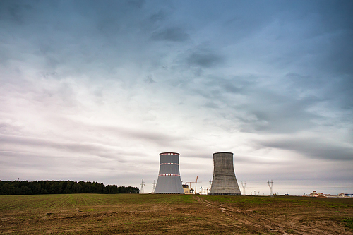 Panoramic view of building of Belarus Nuclear power plant. Nuclear power station in cloudy day with big chimneys. Cooling towers of atomic power plant