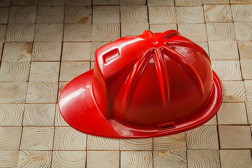 construction tools red helmet on wooden background