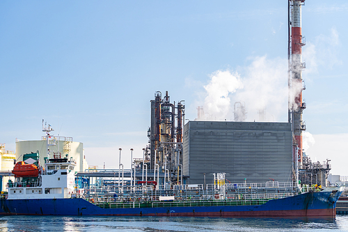 Tanker boat loading fuel from oil Chemical Factory in Kawasaki Japan