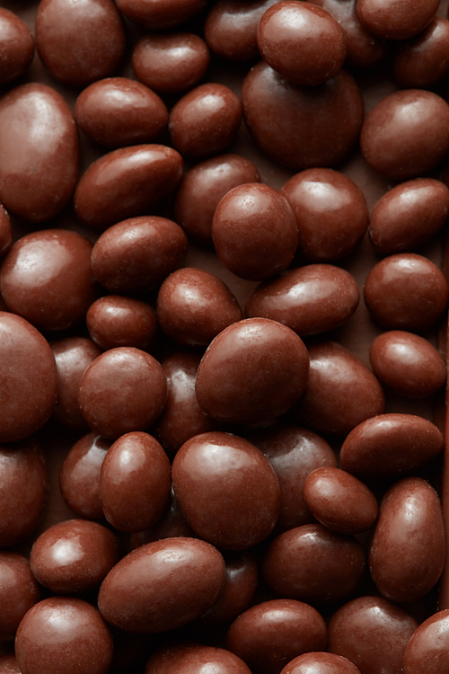 A background of dark chocolate sweets balls.