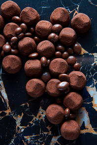 delicious chocolate truffles on a dark marble background
