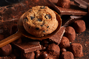 Food background of chocolate chip cookies, candy and cocoa powder
