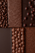 texture of various chocolate with nuts . Food background