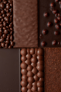 texture of various chocolate with nuts . Food background