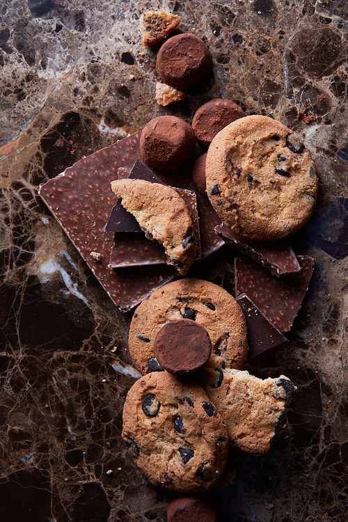 omemade chocolate candy and cookies on a marble background Drops
