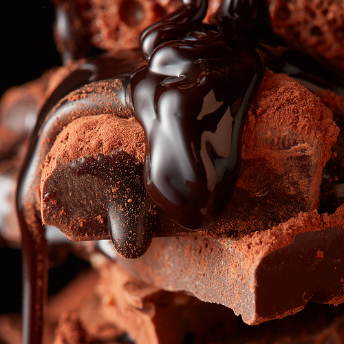 chocolate pieces and chocolate syrup Close up