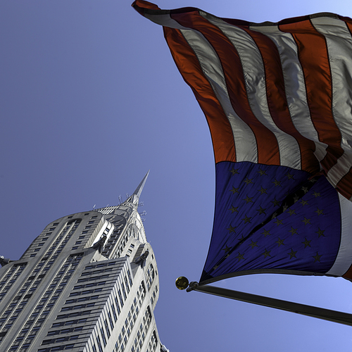 Low angle view of American flag and Chrysler Building, Midtown Manhattan, New York City, New York State, USA