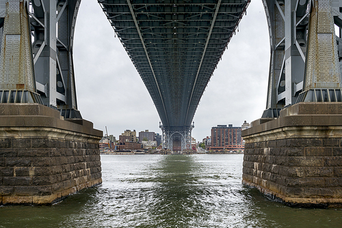 View from underneath Manhattan bridge with Brooklyn city skyline in the background, New York City, New York State, USA