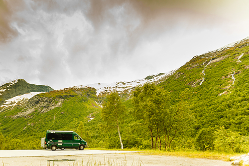 Tourism vacation and travel. Camper van and norwegian mountains landscape