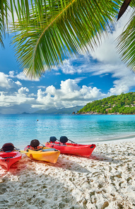 Beautiful Petite Anse beach with kayaks and palm tree at Seychelles, Mahe