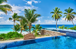 Beautiful Anse Intendance beach with resort swimming pool at Mahe, Seychelles