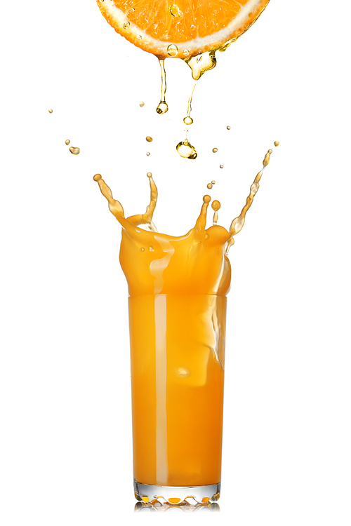 fresh orange juice splash in the glass isolated on white