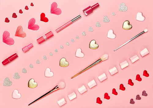 Valentine's Day Background. Red Hearts on a Pink background. Flat Lay. St.Valentine's Day Wallpaper. Make Up Brushes. Lipstick and nail Polish