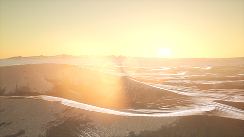 aerial of the red sand desert dunes at sunset