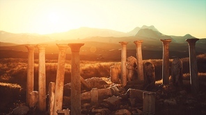 old greek temple ruins at sunset
