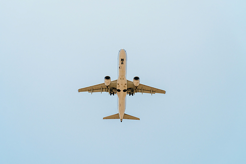 Passenger Airplane Flying On Clear Blue Sky
