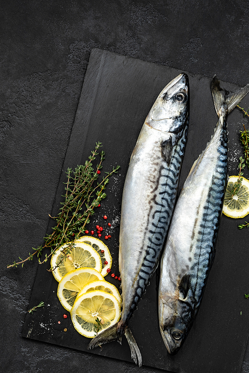 Mackerel. Fresh raw fish with ingredients for cooking, top view, flat lay