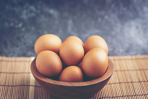 eggs in wooden bowls, dairy product for health care