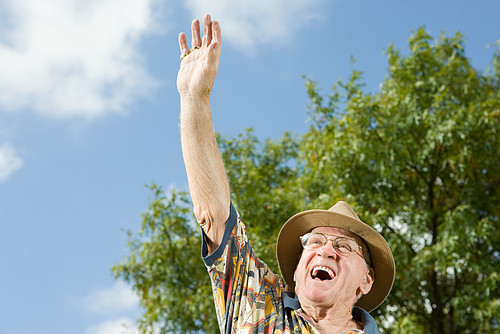 Senior man waving