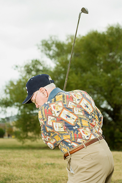 Senior man playing golf