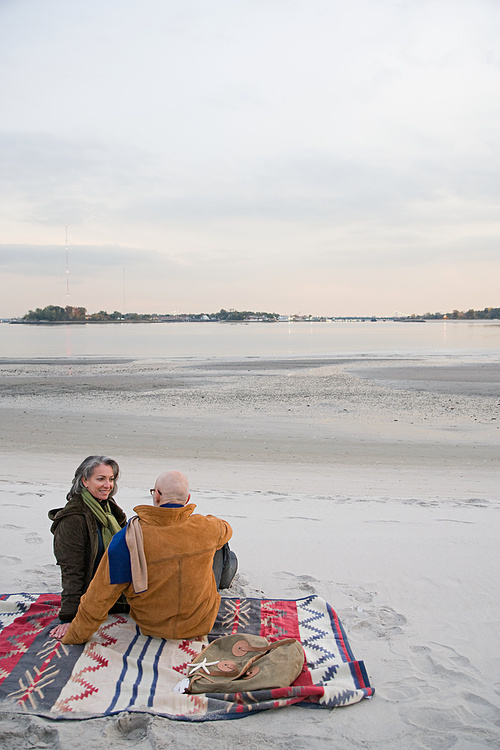 Mature couple resting at the beach