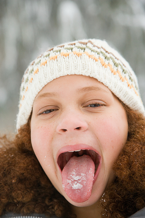Girl with snow on her tongue