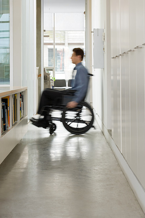 Blurred man in a wheelchair