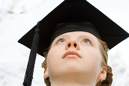 Female graduate looking up