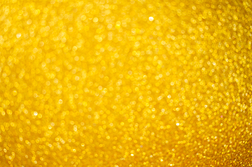 Christmas holiday festive glittering defocused golden background with bokeh