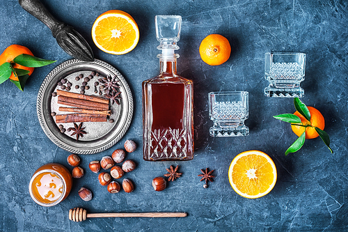 Hot wine with orange and spices set on dark slate background
