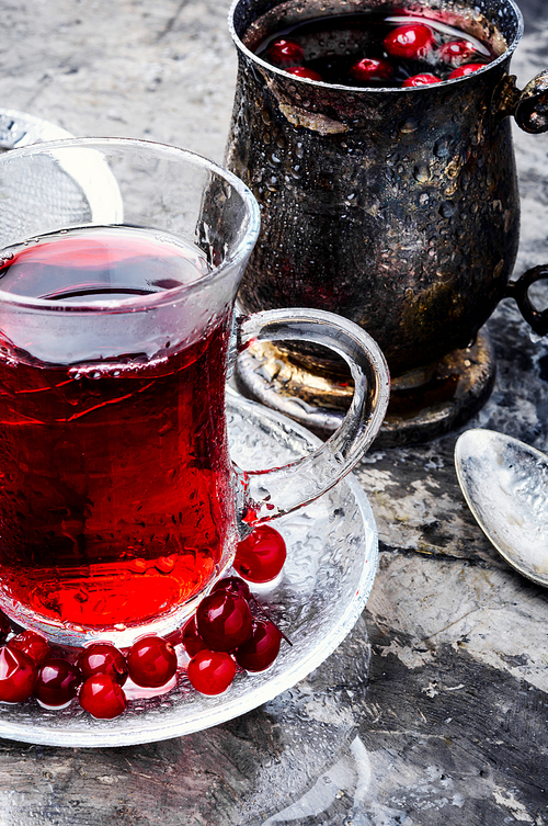 Cranberry tea in a glass cup.Winter hot tea