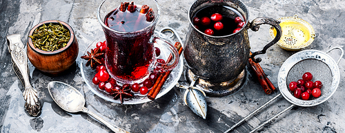 Autumn or winter hot tea with berries