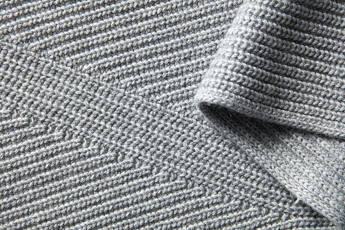 clothing background of knitted cotton waffle fabric with wrinkles and folds
