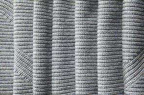 A full page of a loose gray knit fabric texture